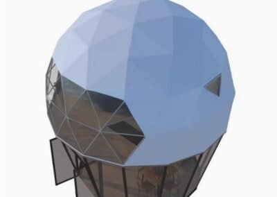 A geodesic dome structure with a blue exterior and large glass windows and doors at the front.